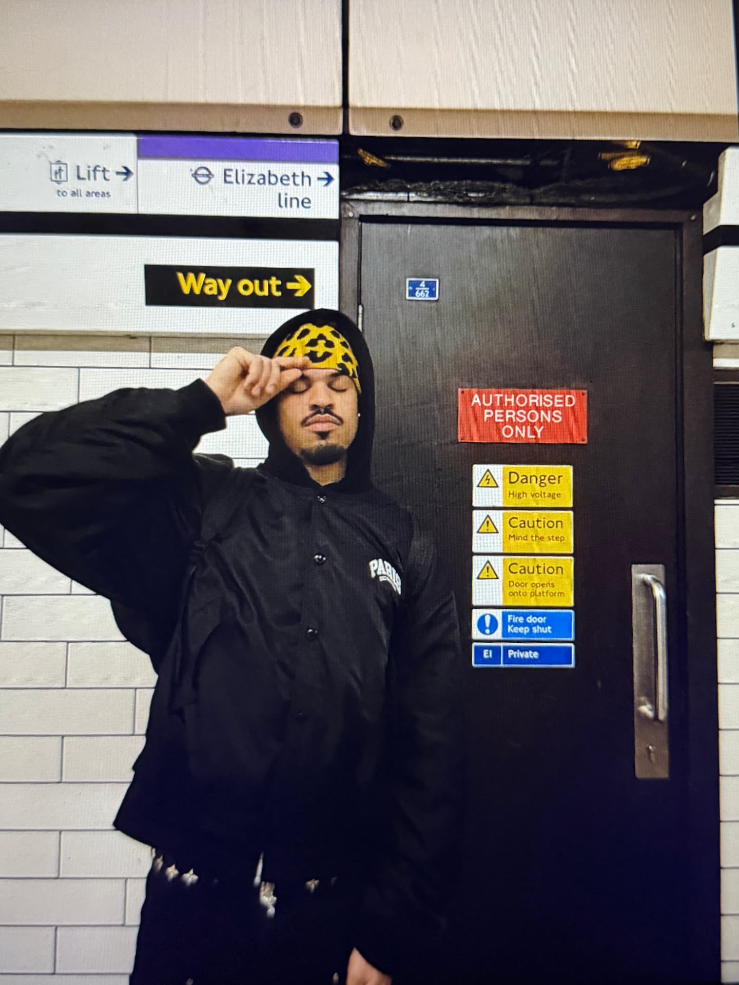 Jaywakeup on a London Underground platform in front of an Elizabeth line sign